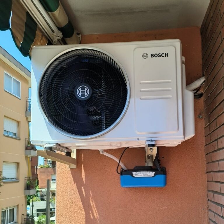Bosch outdoor unit on a balcony with a condensate pump, installed by JAG Alcaide