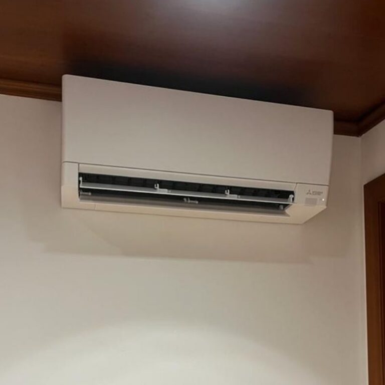 Mitsubishi Electric wall split under a wooden ceiling, installed by JAG Alcaide